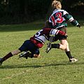 Schoolkids doing a rugby tackle.jpg